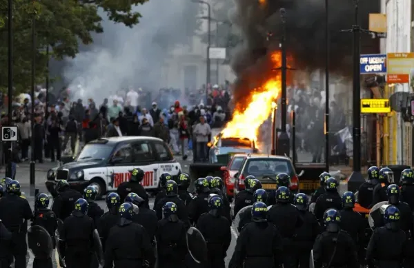 London rioters face off against cops.